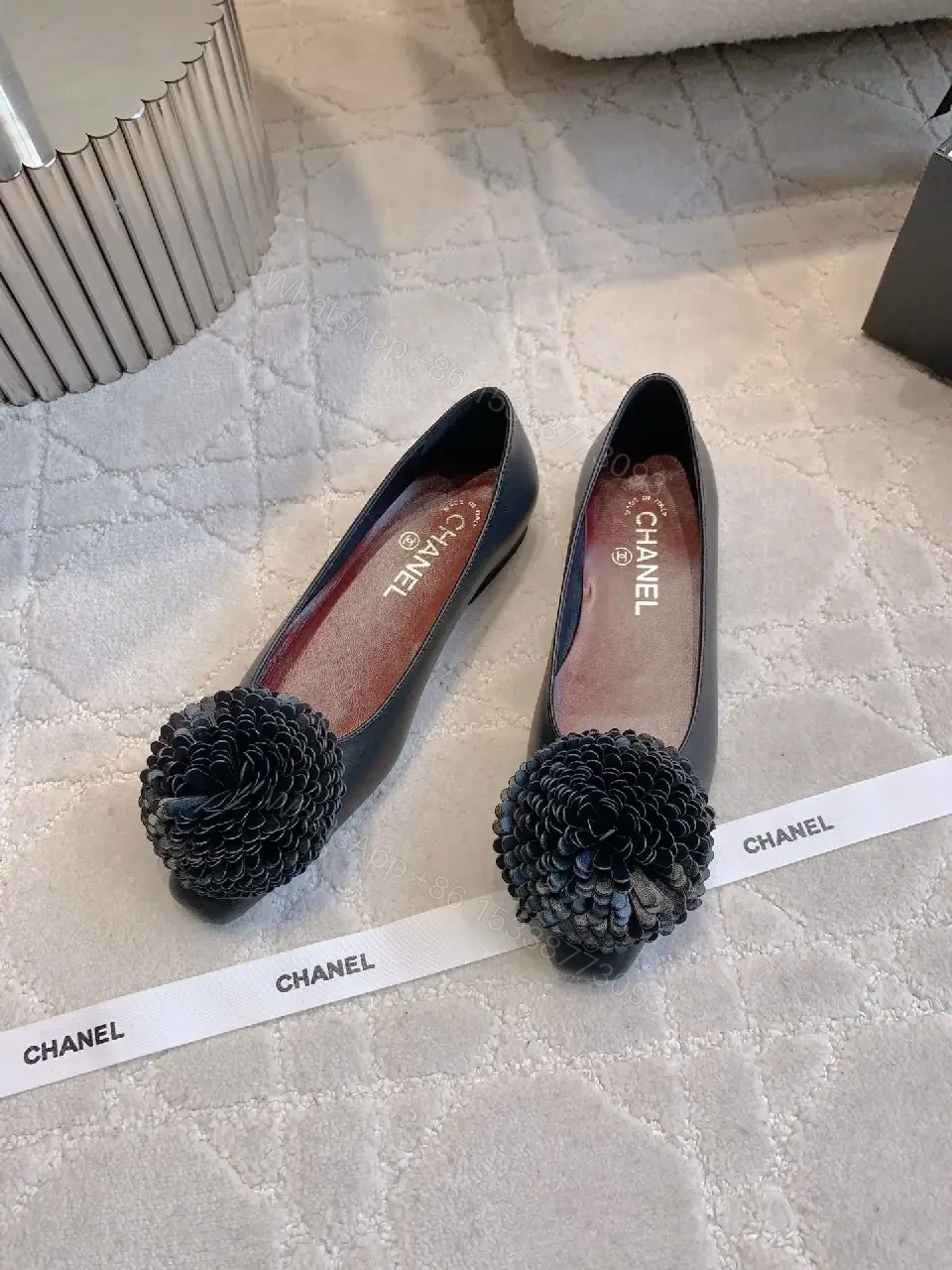 View 10 of Chic Black Pointed Flats with Floral Pom-Pom Detail