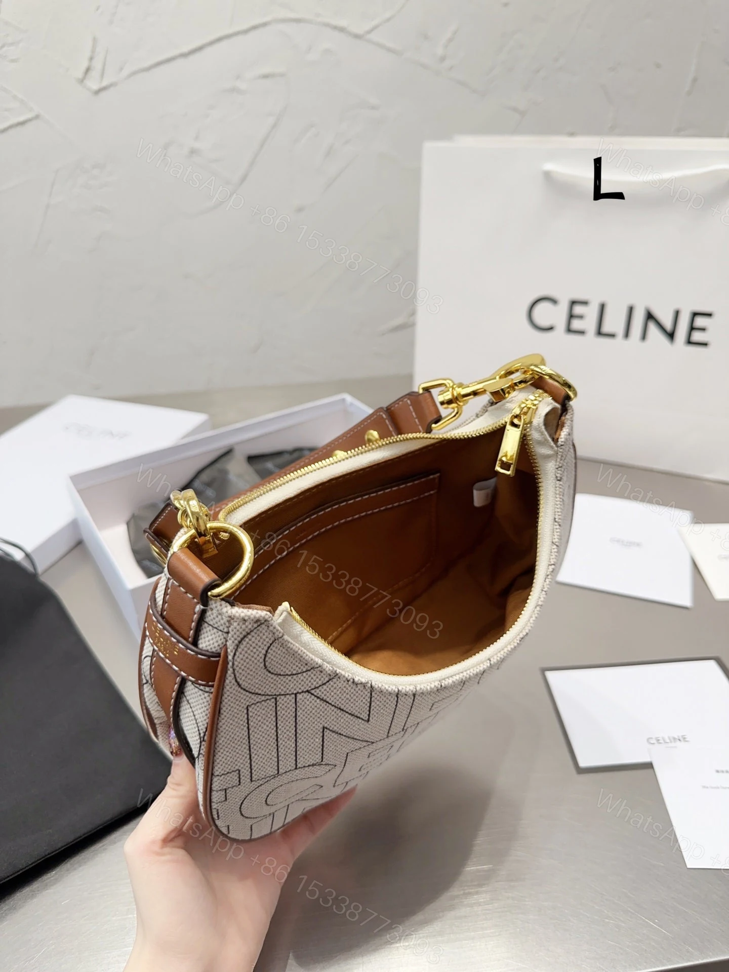 View 2 of CELINE MEDIUM AVA STRAP BAG IN TEXTILE WITH ALL OVER PRINT NATURAL 25CM 196922ERK02NT