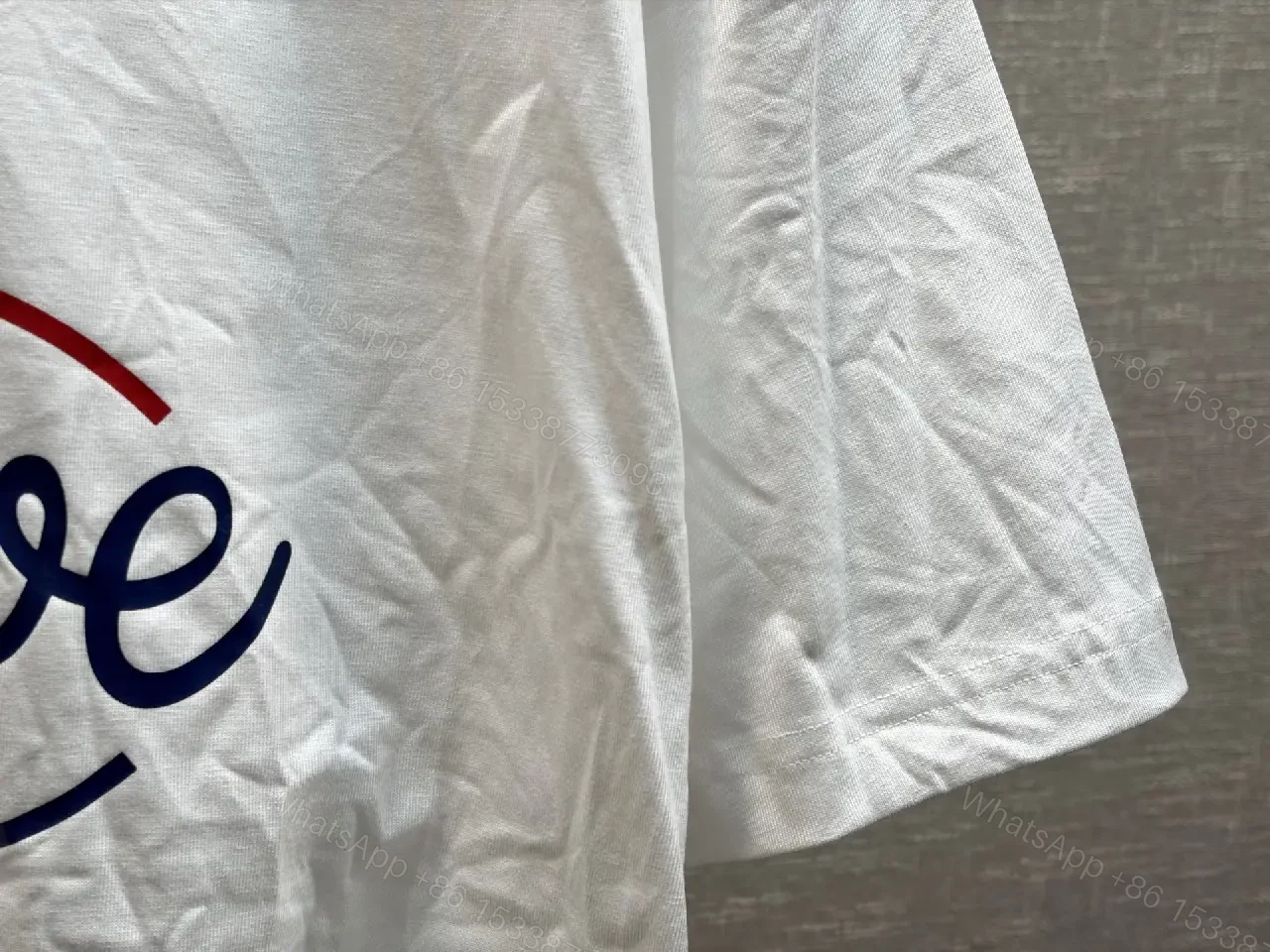 View 4 of Casual Luxe Tee: White Cotton, Oversized LOEWE Graphic