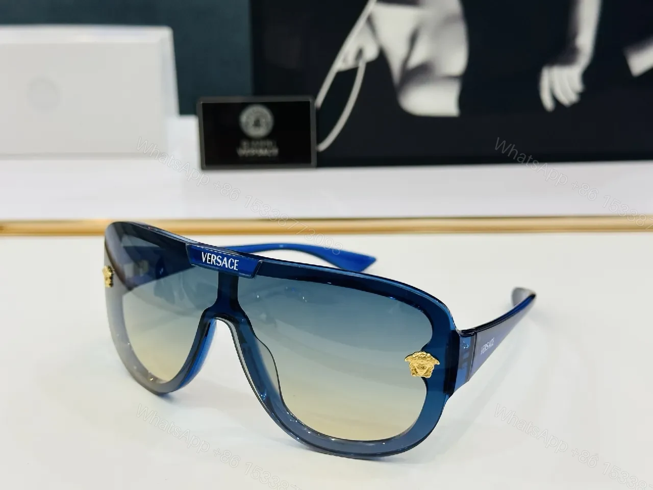 View 3 of Black Gloss Shield Sunglasses with Gold Emblems, Oversized Style