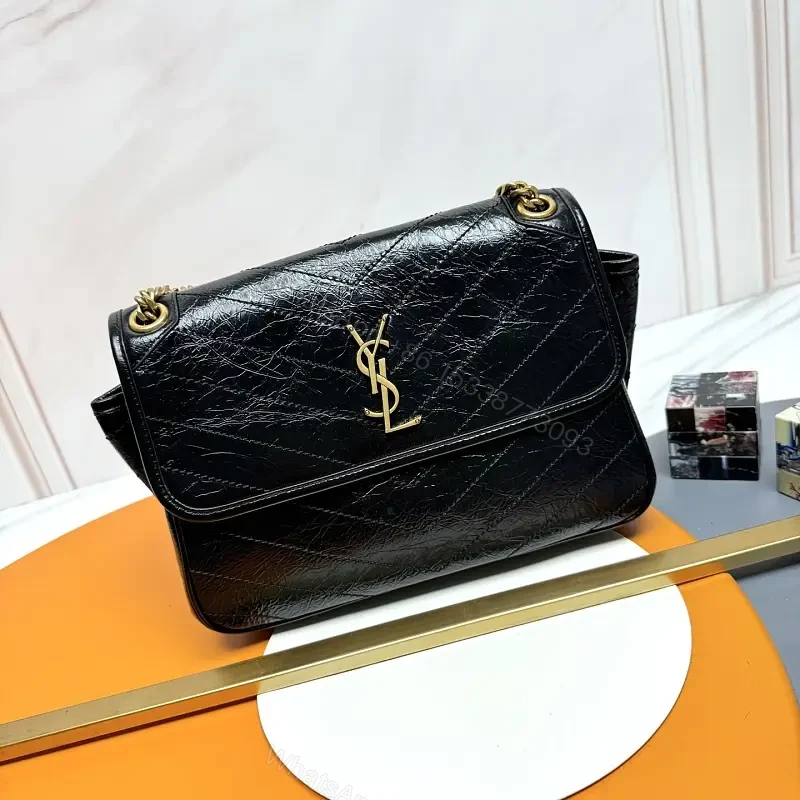 Chic Black Quilted Leather Shoulder Bag with Gold Hardware — view 1