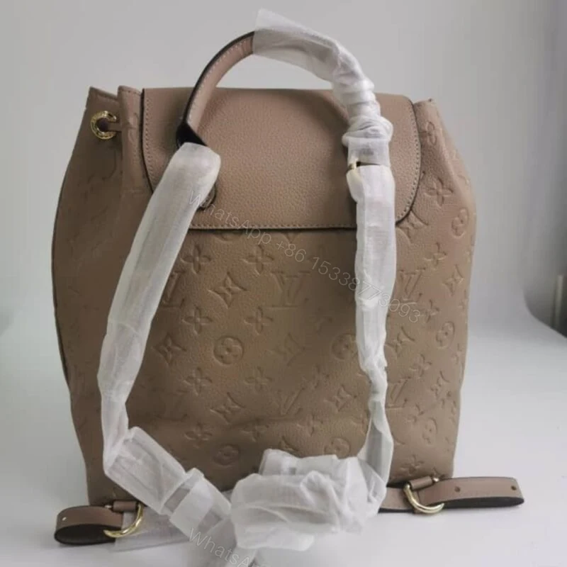 View 4 of Louis Vuitton Montsouris Backpack Empreinte Turtledove 32Cm M45410
