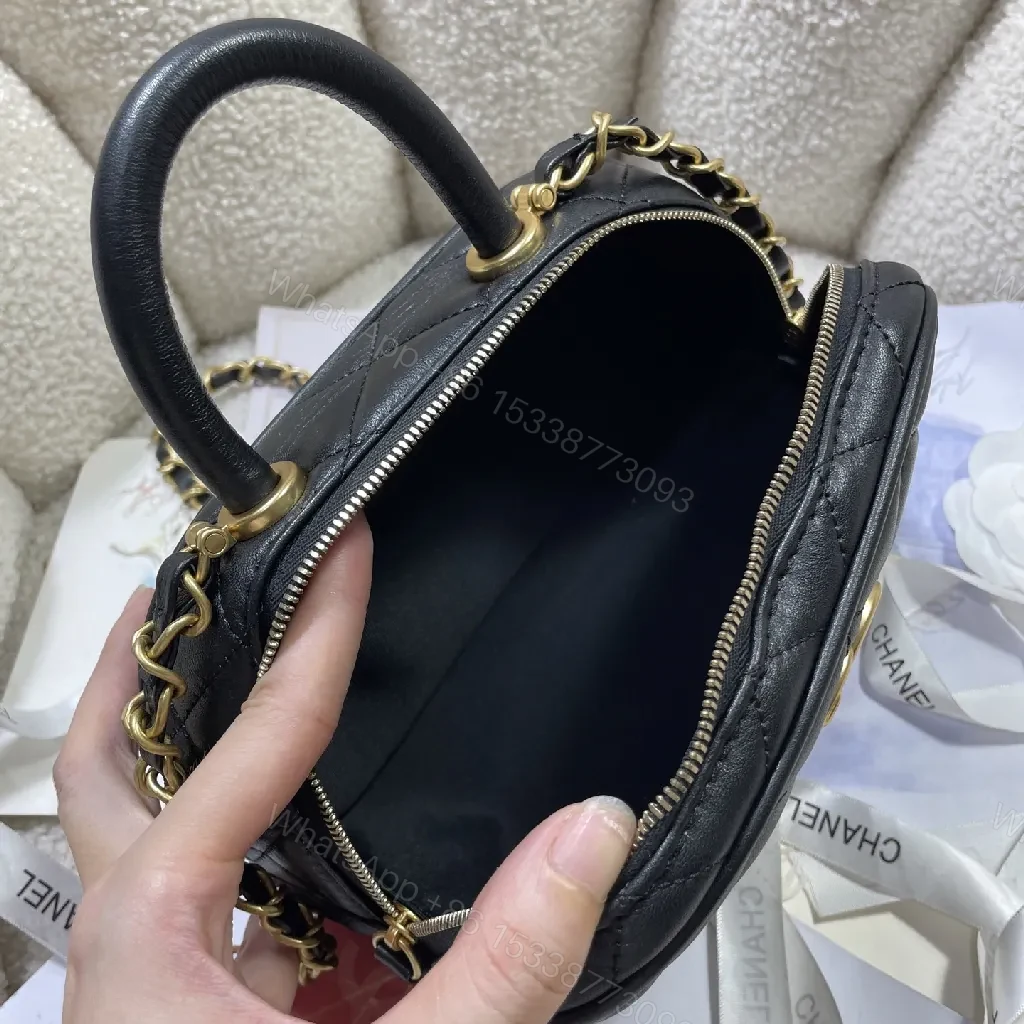 View 9 of Compact Black Quilted Handbag with Gold Logo Chain