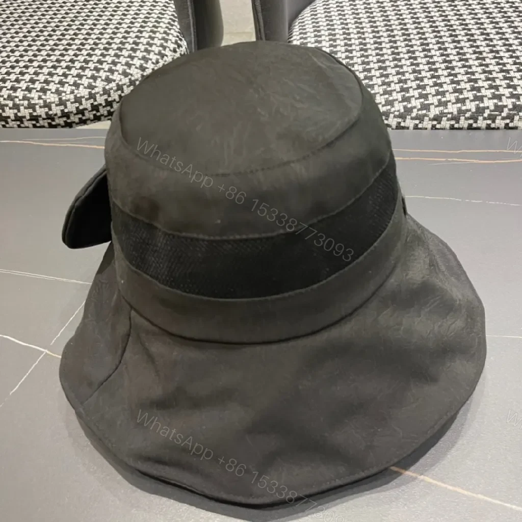 View 11 of Minimalist Black Bucket Hat with Discreet Luxe Label