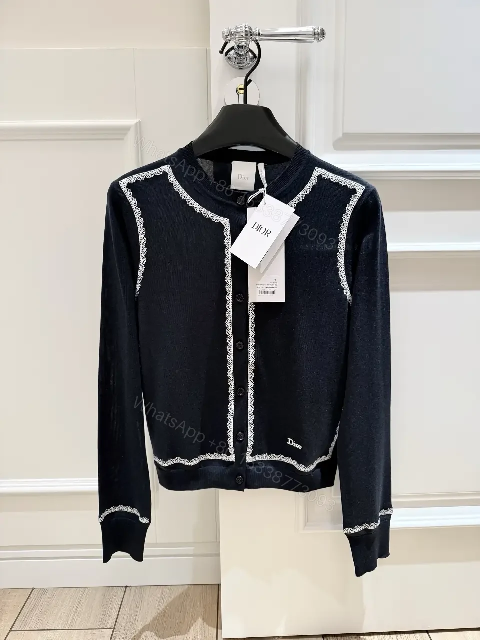View 10 of Navy Knit Cardigan: White Piping, Modern Contrast, All-Day Comfort