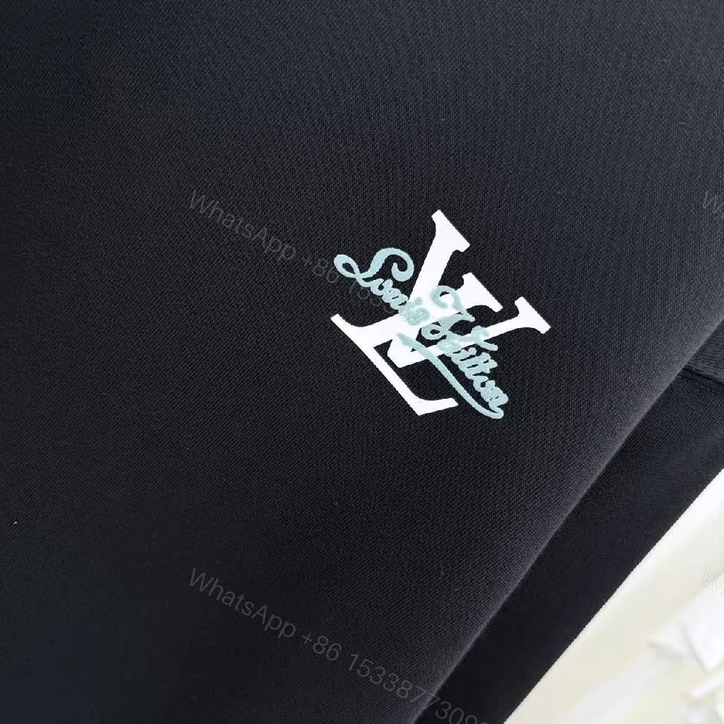 View 6 of Minimalist Black Crewneck with Subtle LV-Accent - Luxury Staple