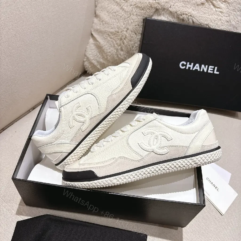 View 9 of Cream Leather-Texture Sneaker with Signature Emblem, Modern Couture Style
