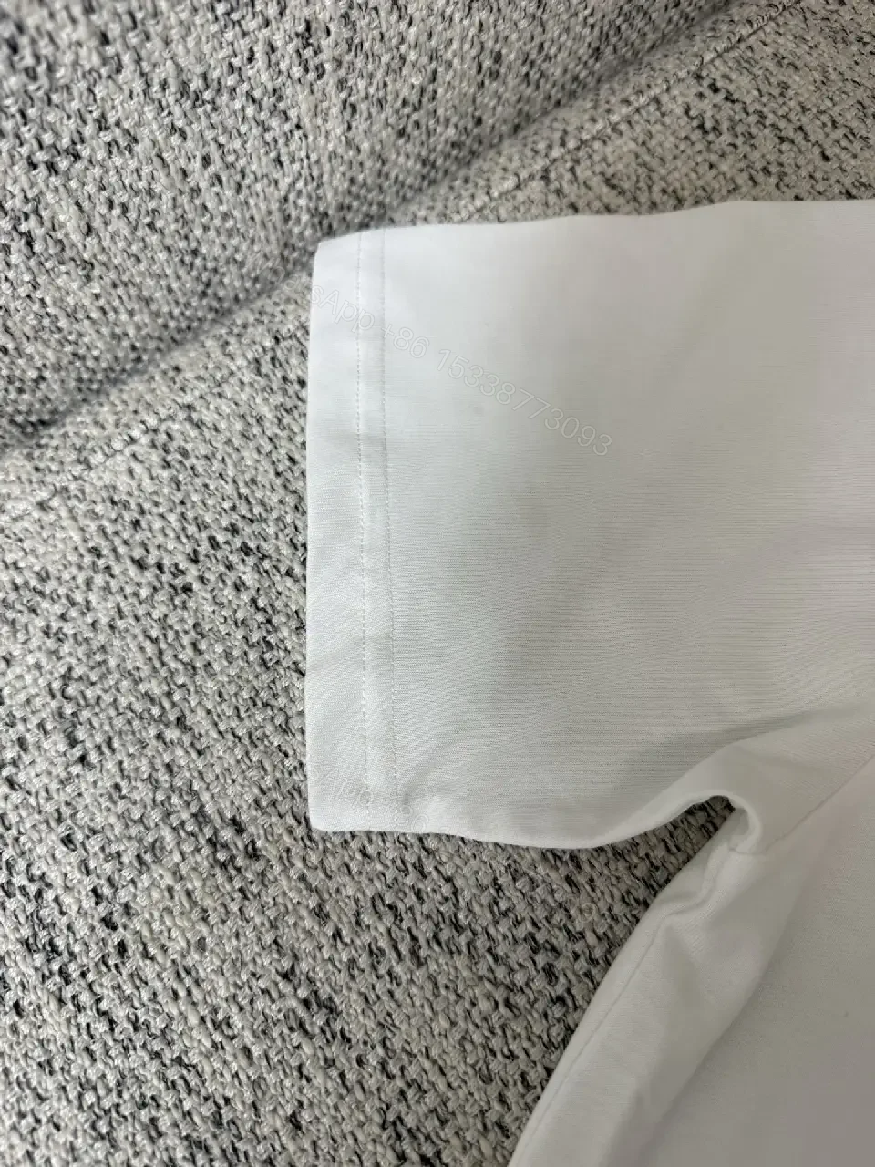 View 3 of Minimalist White Cotton Tee with Subtle Logo