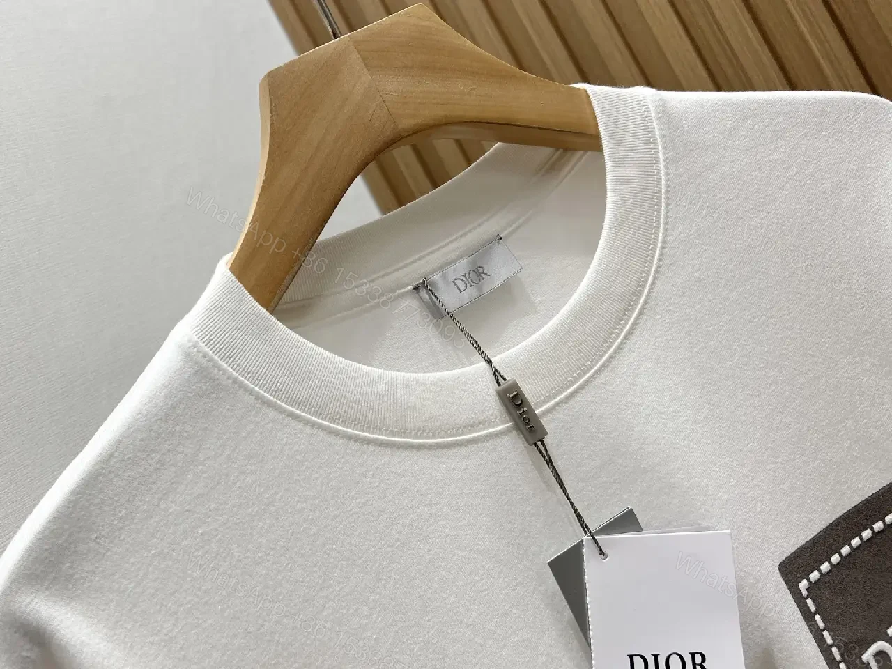 View 9 of Minimalist White Tee with Dior Pocket: Subtle Luxury T-Shirt