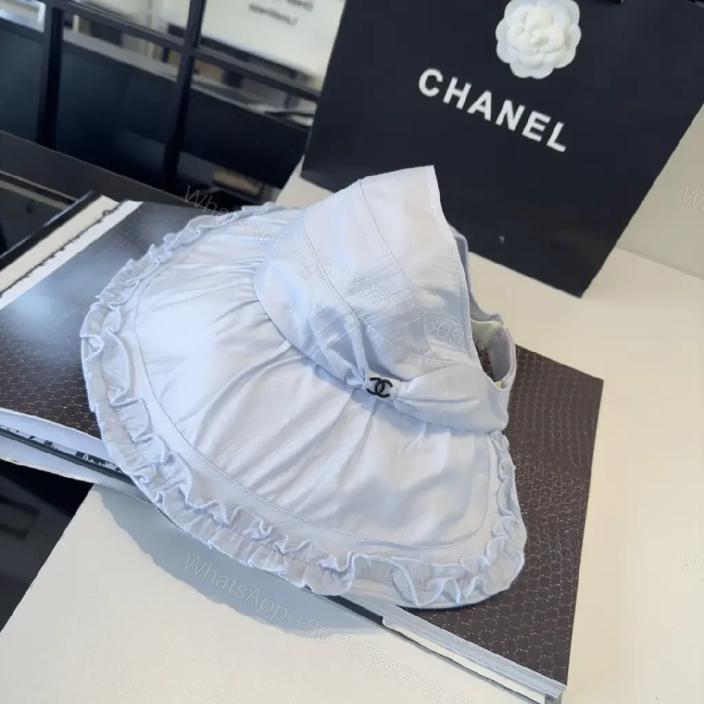 View 2 of Pastel Blue Floppy Hat with Ruffled Brim & Chanel Charm