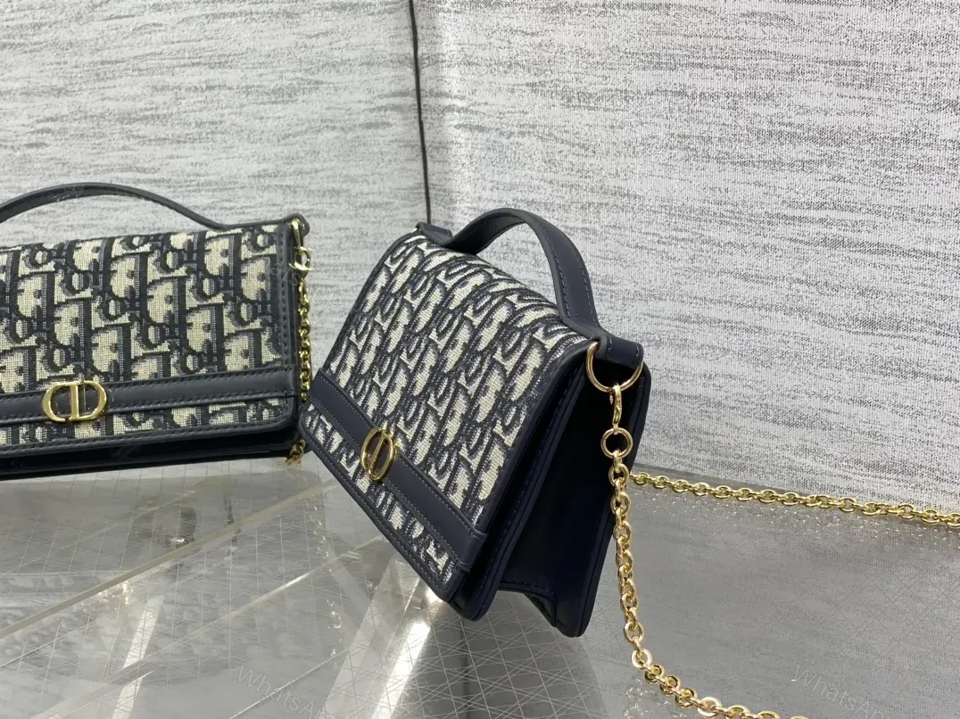 View 2 of Navy monogram canvas leather-trim shoulder bag for everyday luxury