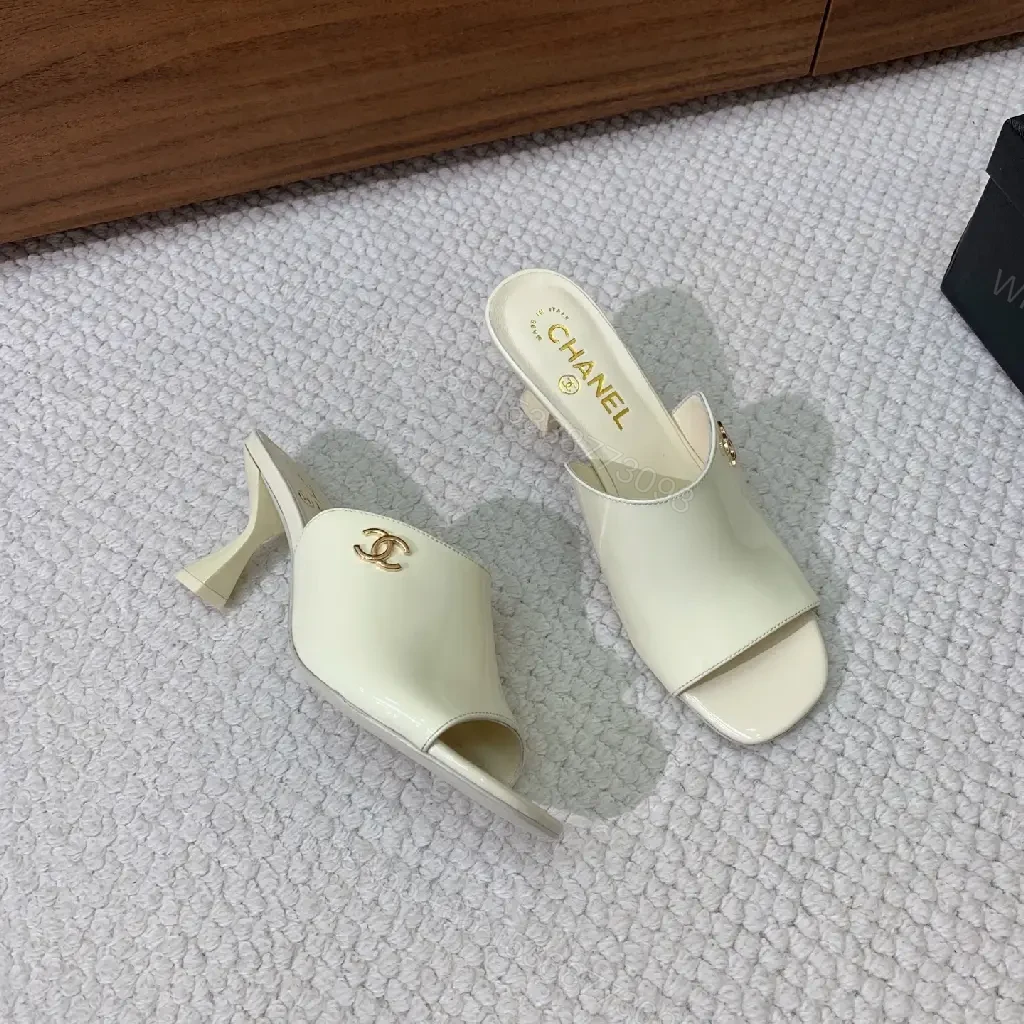 View 2 of Cream Leather Slide Sandals, Pearl White, Chanel Logo, Midsize Heel Mules
