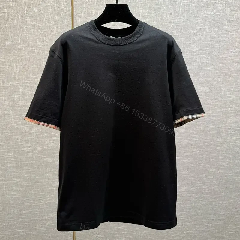 Minimalist Black Cotton Tee with Plaid Sleeve Trim — view 1
