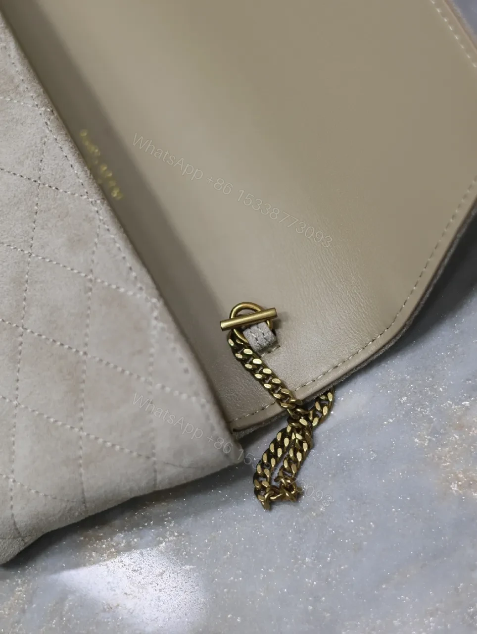 View 6 of Quilted Suede Clutch with Gold Logo Hardware - Classic Chic Clutch