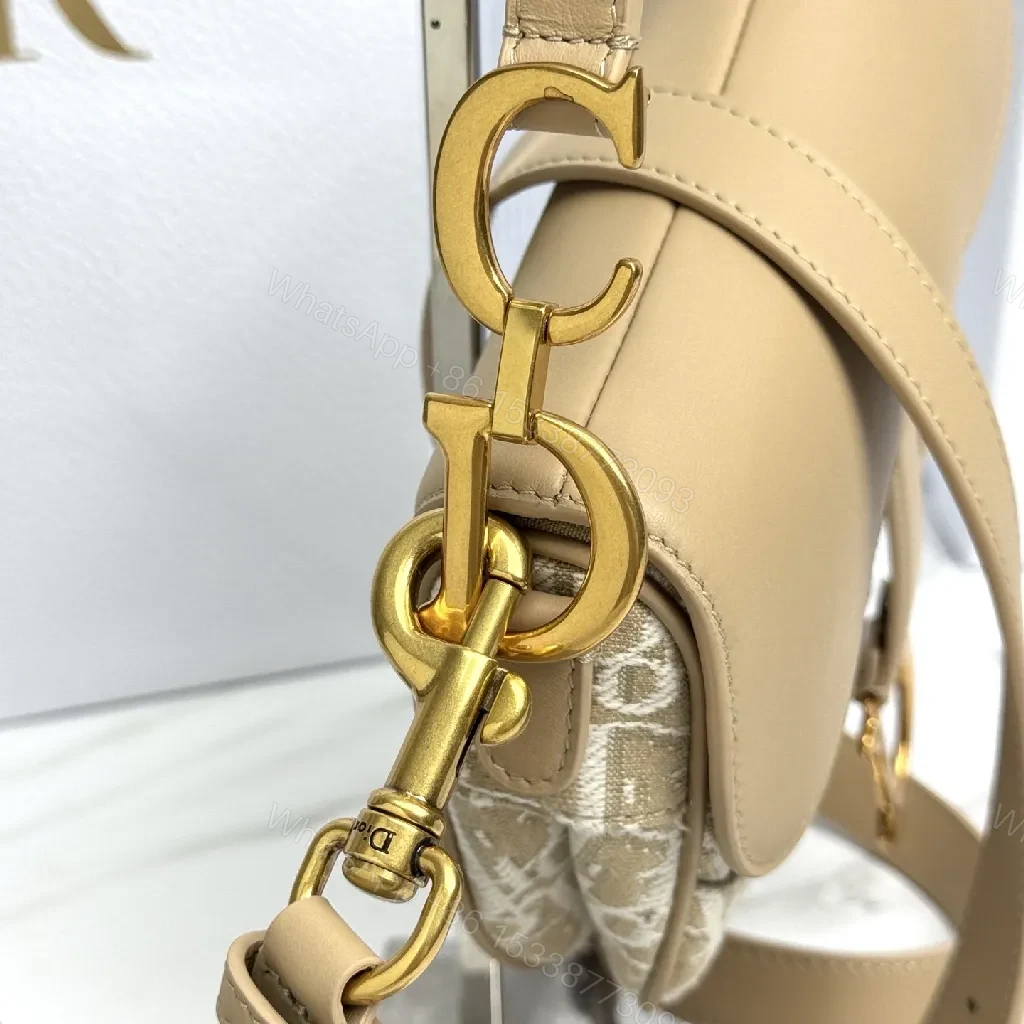 View 5 of Beige Leather-Trim Mini Saddle Bag, Monogram Canvas, Crossbody