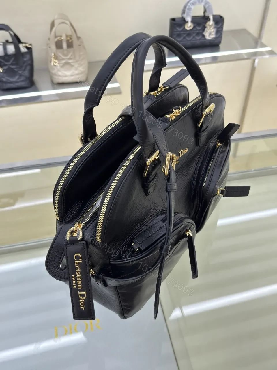 View 3 of Compact Luxury Satchel: Black Leather, Gold Hardware, Structured Style