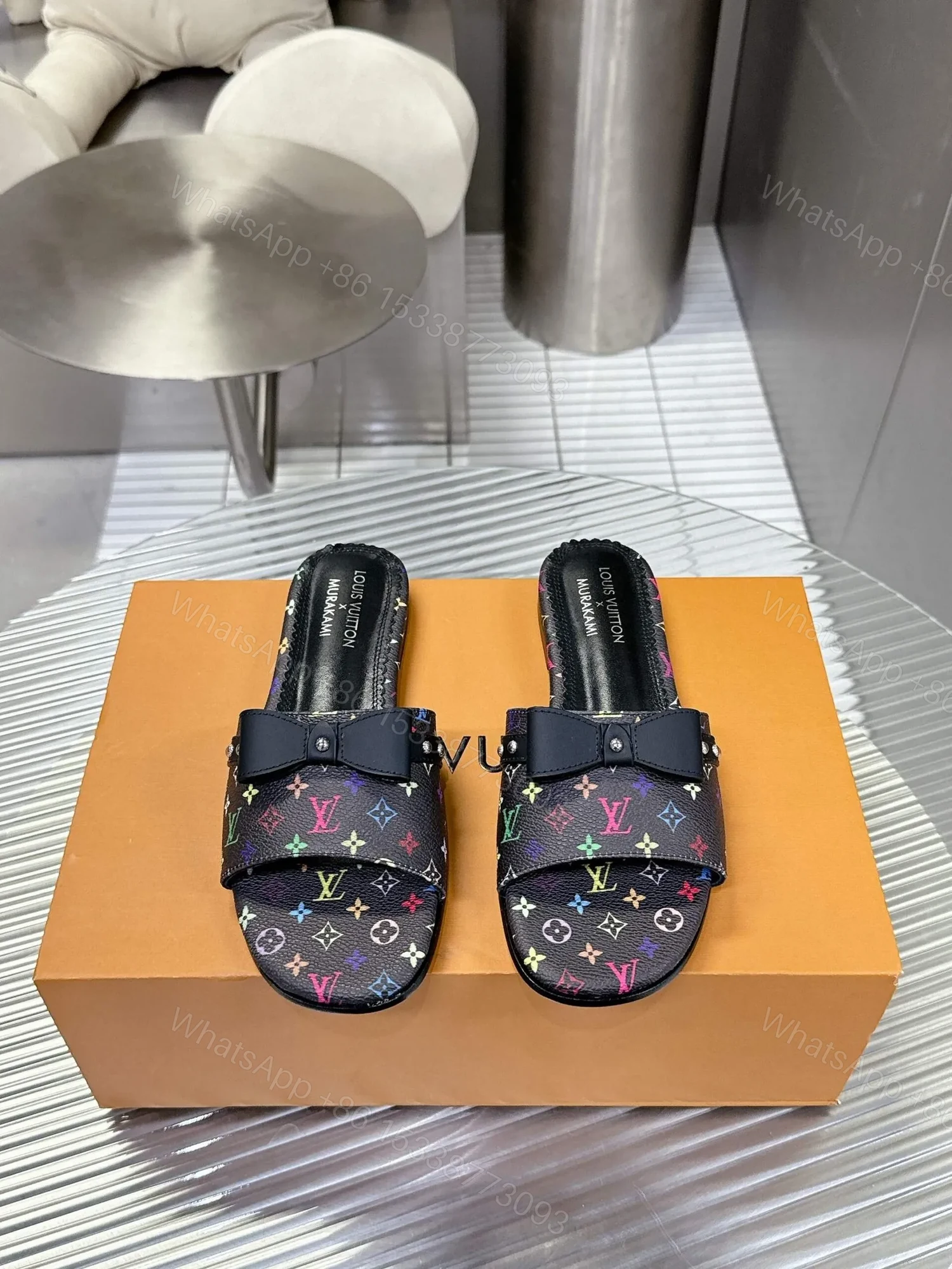 LV Women Black Patterned Leather Bow Slide Sandals — view 1