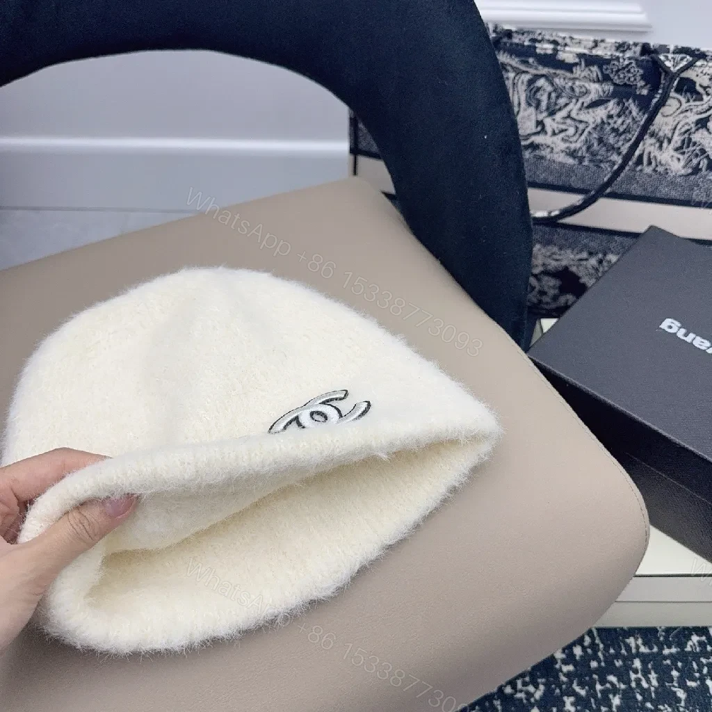 View 3 of Ivory Plush Handwarmer: Luxe Logo-Embossed, Lightweight Warmth