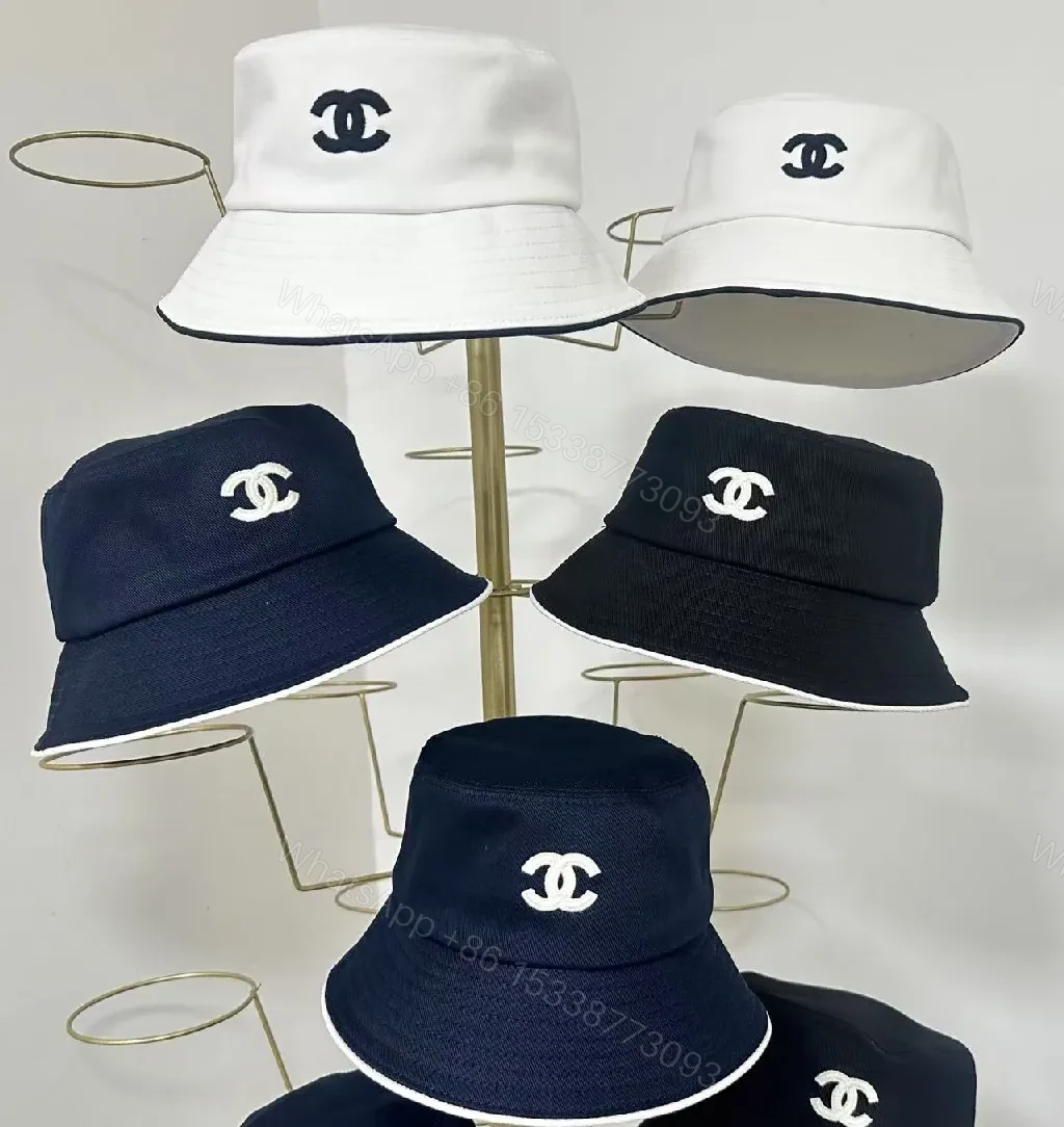View 11 of Beige/Navy Black Bucket Hat – Iconic Logo, Breathable Brim, Luxe Style