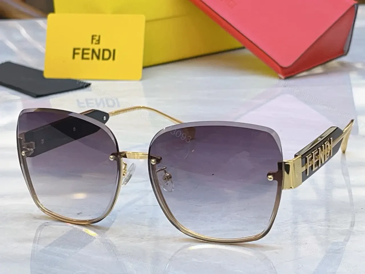 View 2 of Gold Frame Pink Gradient Sunglasses with FENDI Logo