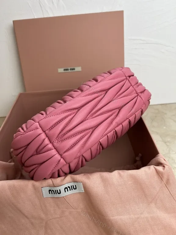 View 2 of Pink Quilted Miu Miu Mini Bag â€“ Luxury Everyday Chic