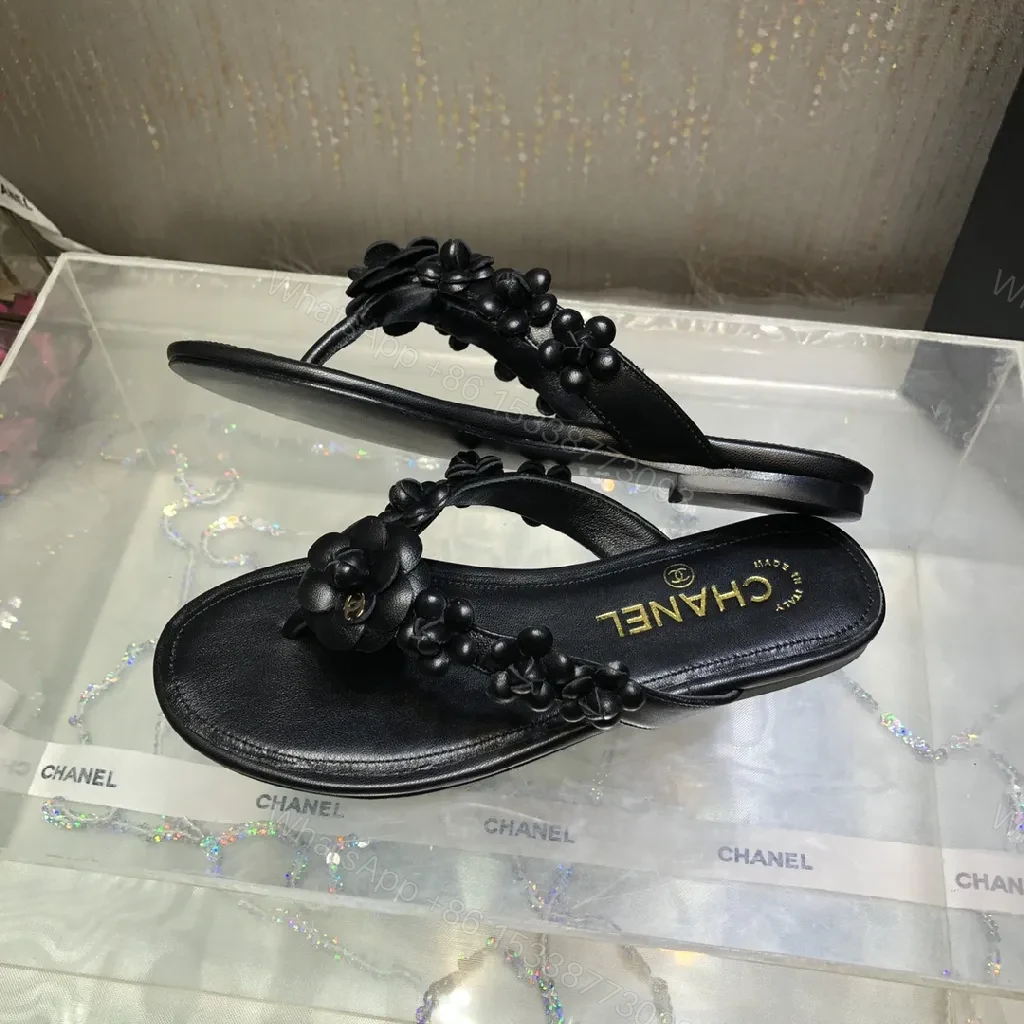 View 9 of Black Leather-Feel Floral Slip-Ons with Luxe Accents