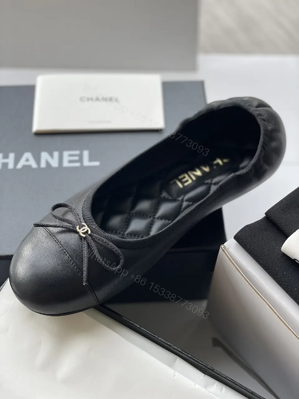 View 6 of Quilted Black Flats with Gold Logo Accents - Chic Comfort