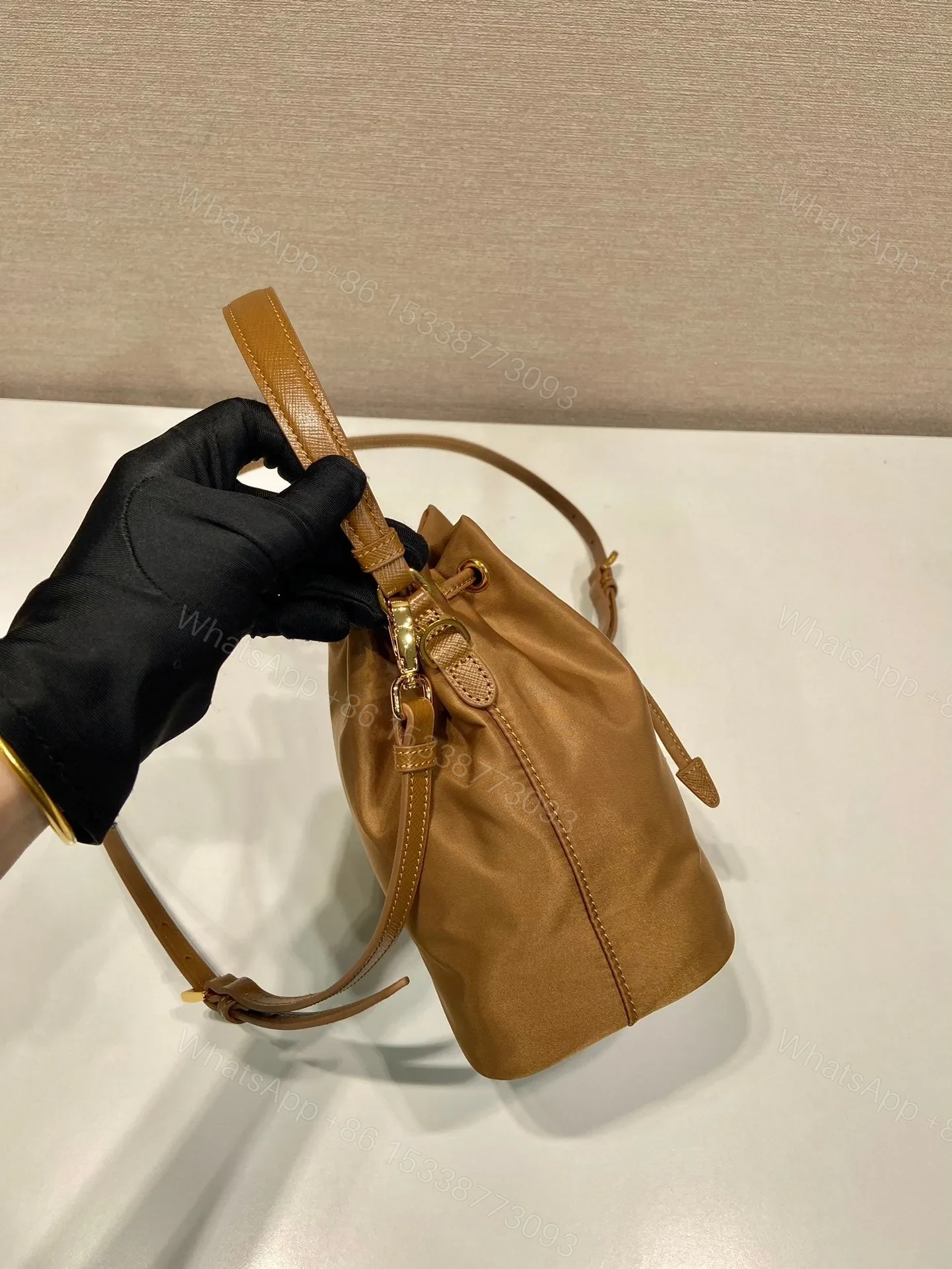View 3 of BUCKET BAG 19 IN RUSSET BROWN RE-NYLON AND CALFSKIN HANDLE