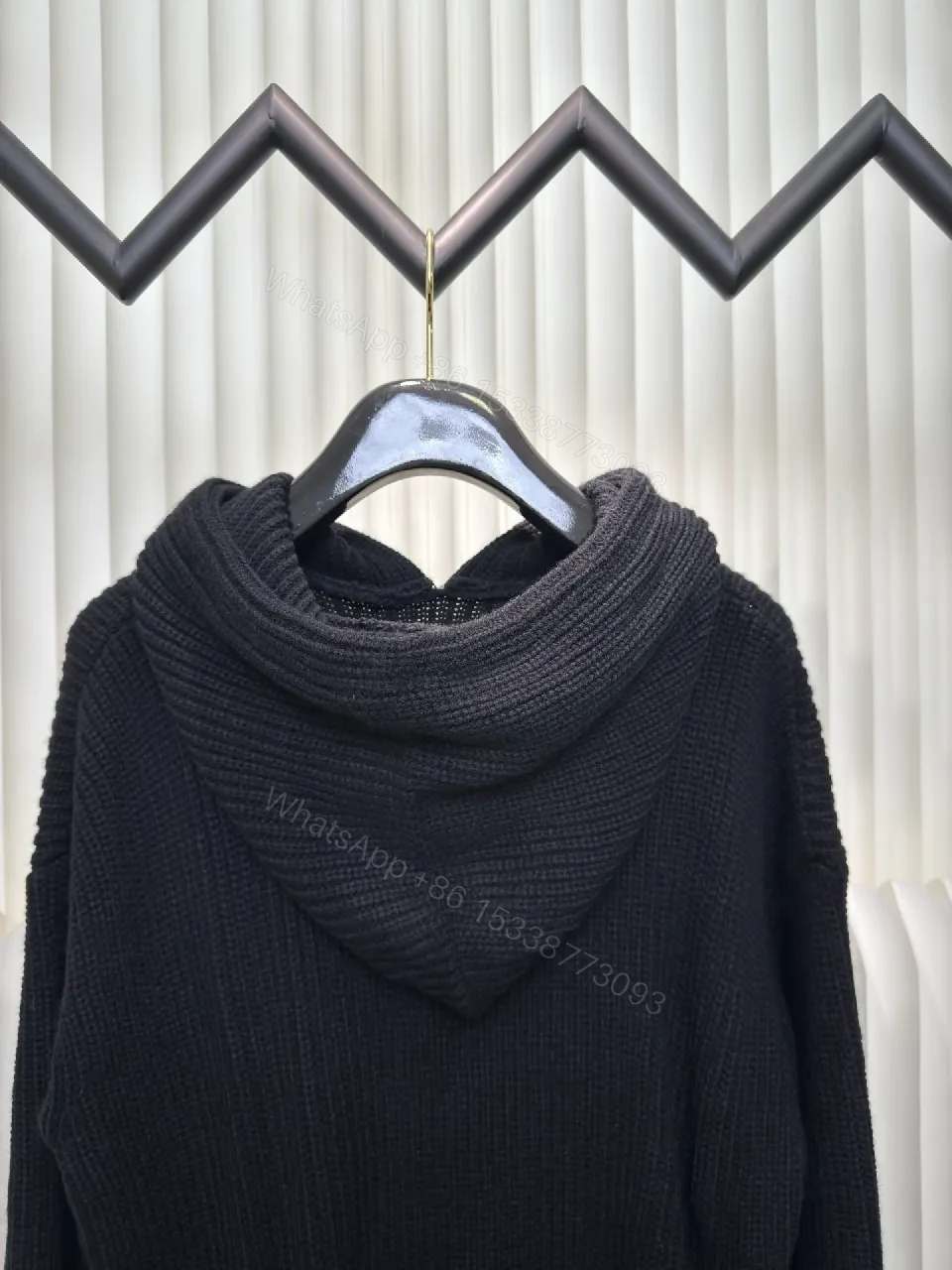 View 8 of Chunky Knit Hoodie in Deep Black with Subtle Logo Embossing, Modern Luxe