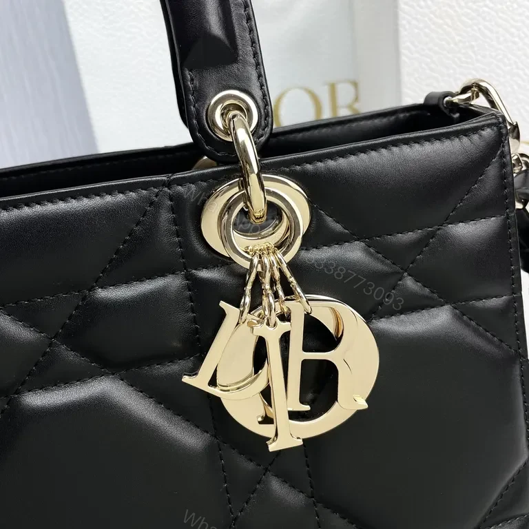 View 2 of Chic Black Quilted Mini Bag with Gold Dior Charms, All-Day Luxury