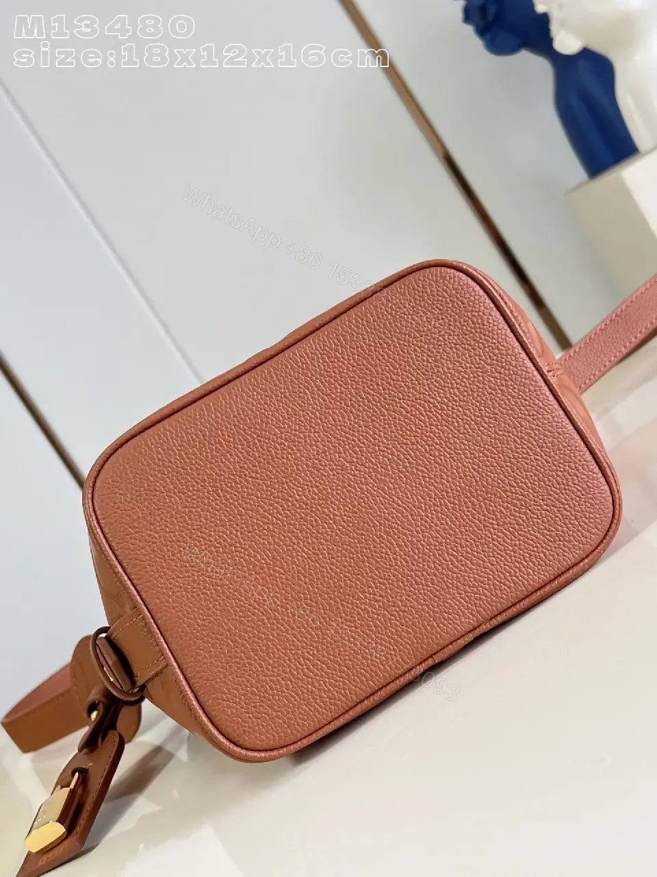 View 4 of Soft-Tone Cropped Bucket Bag with Monogram Embossing Bag