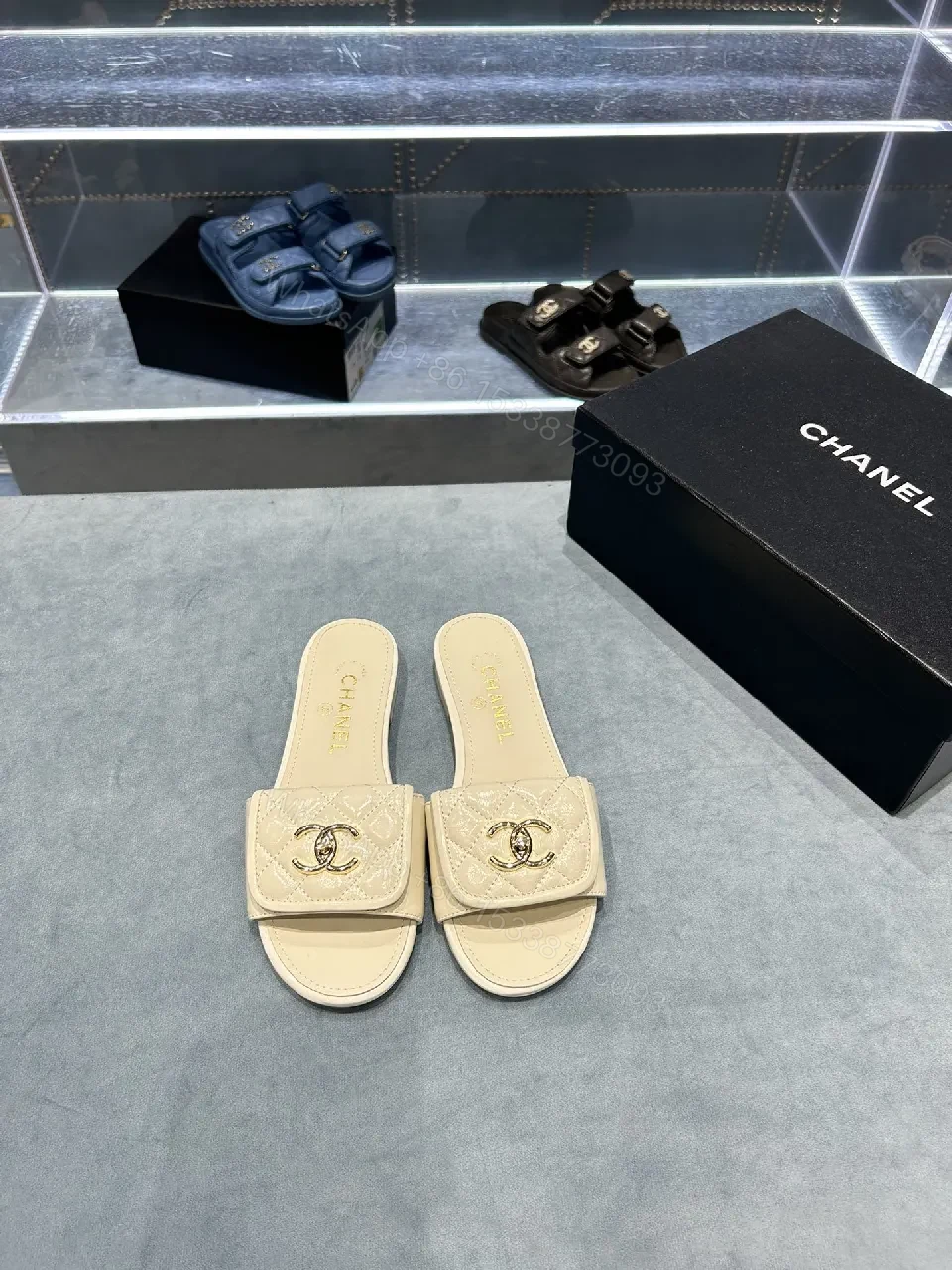 View 2 of Beige Quilted Strap Slide Sandals with Gold Double-C Logo