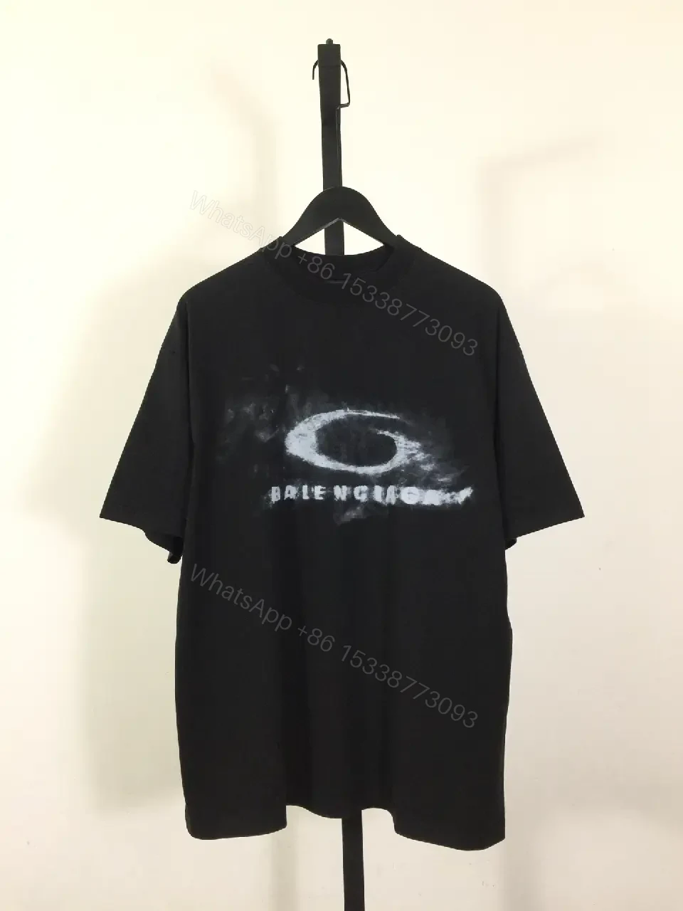 View 2 of Bold Graphic Tee with Distressed Logo: Luxe Streetwear Tee