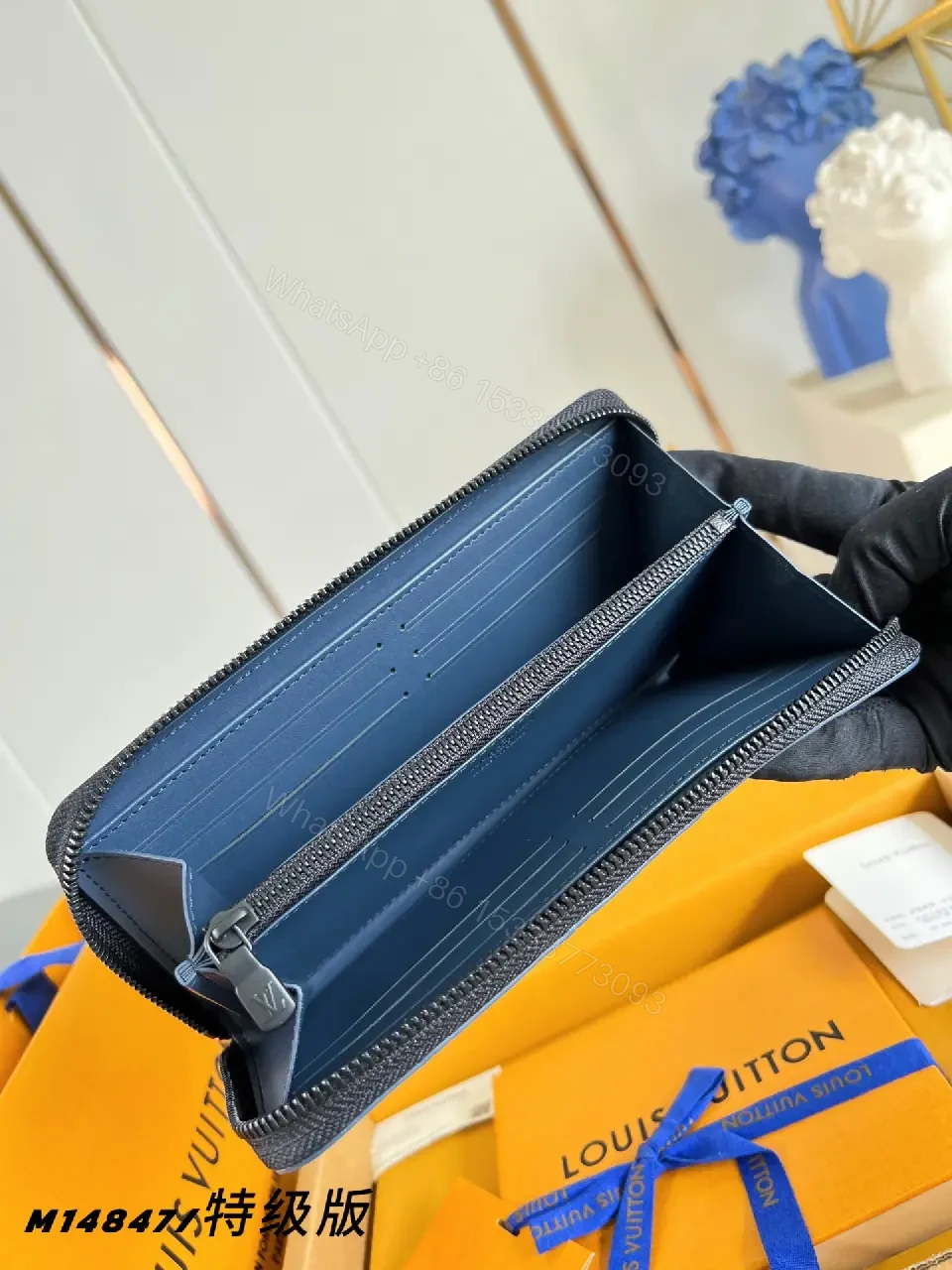 View 3 of Blue Embossed Leather Minimalist Zip Wallet with LV Pattern