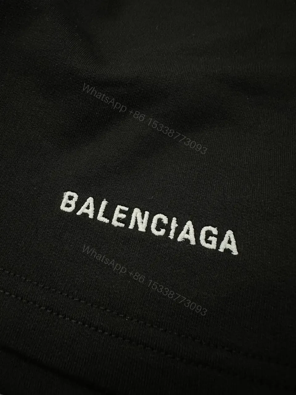 View 4 of black nylon shorts with logo motif for luxury everyday wear