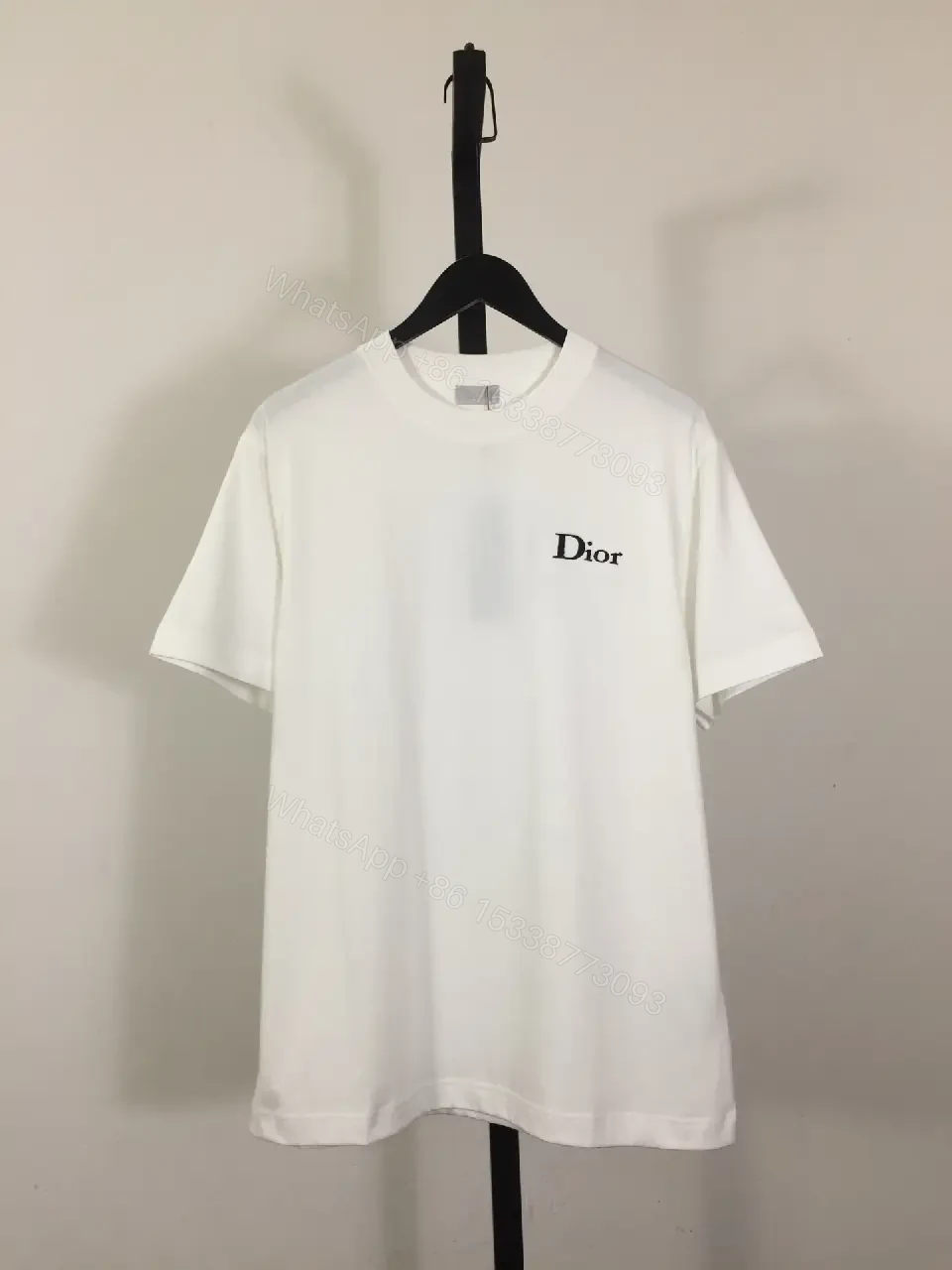 View 3 of Minimalist White Tee: Premium Cotton, Subtle Logo, Classic Fit tee