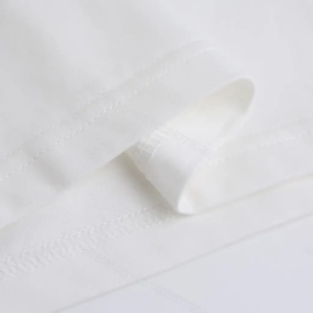View 10 of White Cotton Graphic Tee — Bold Logo, Elevated Casual