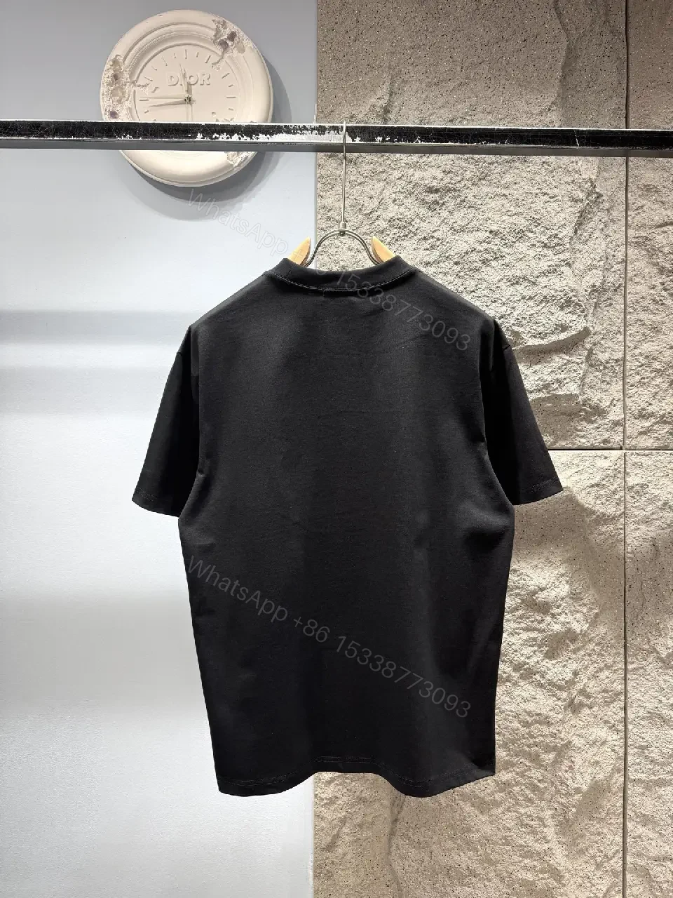 View 6 of Minimalist Black Tee with Subtle Logo – Everyday Luxe Tee