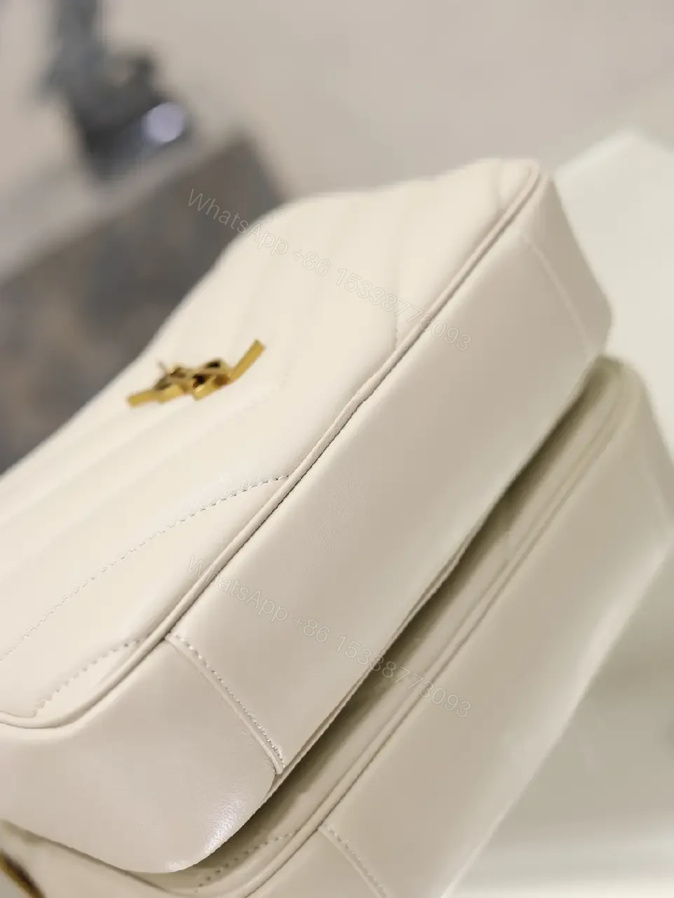 View 7 of Off-White Cream Quilted Chevron Crossbody Bag with Gold Logo