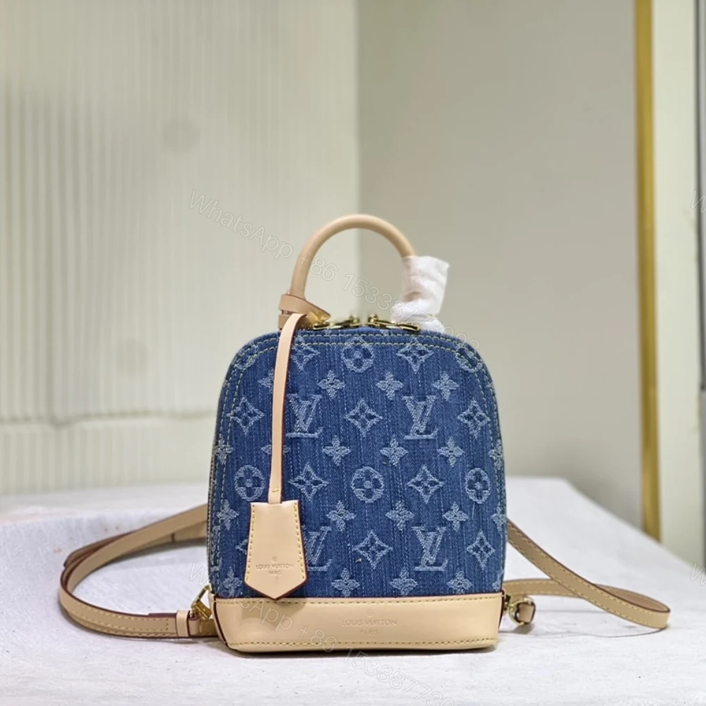 View 2 of Louis Vuitton Alma Backpack Blue Denim 20Cm
