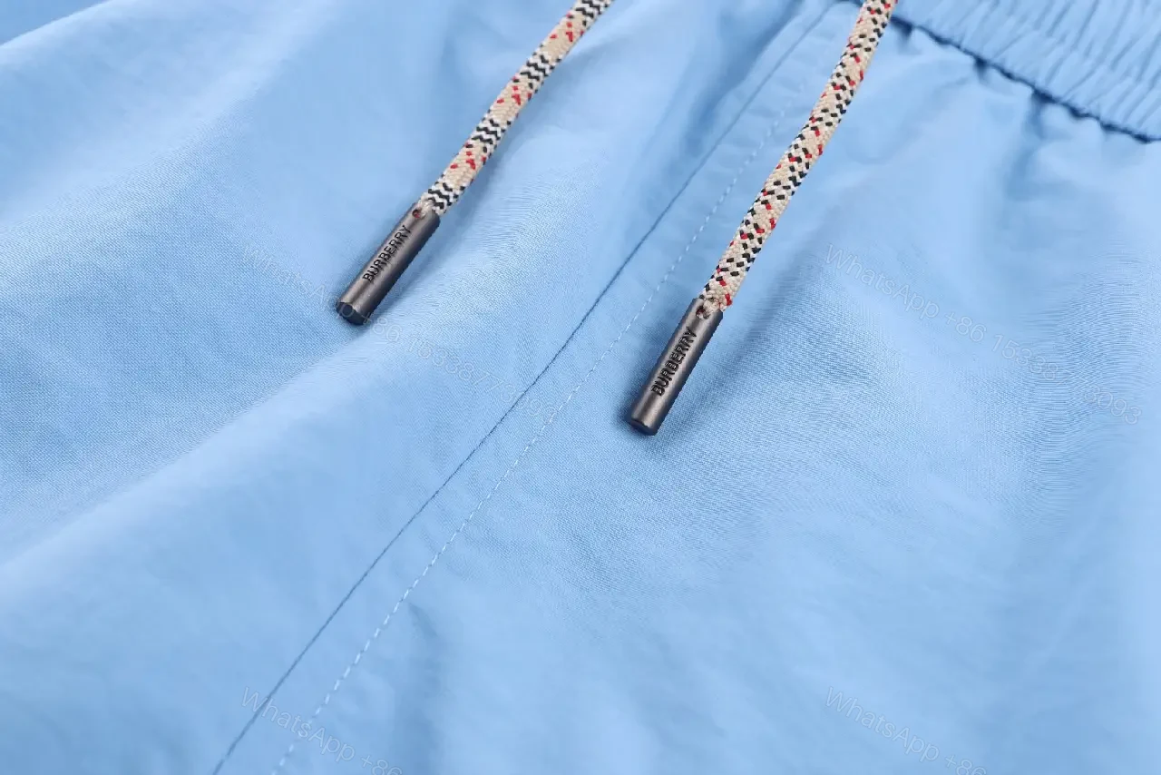 View 5 of Light Blue Cotton-Blend Swim Shorts with Burberry-Check Side Strips
