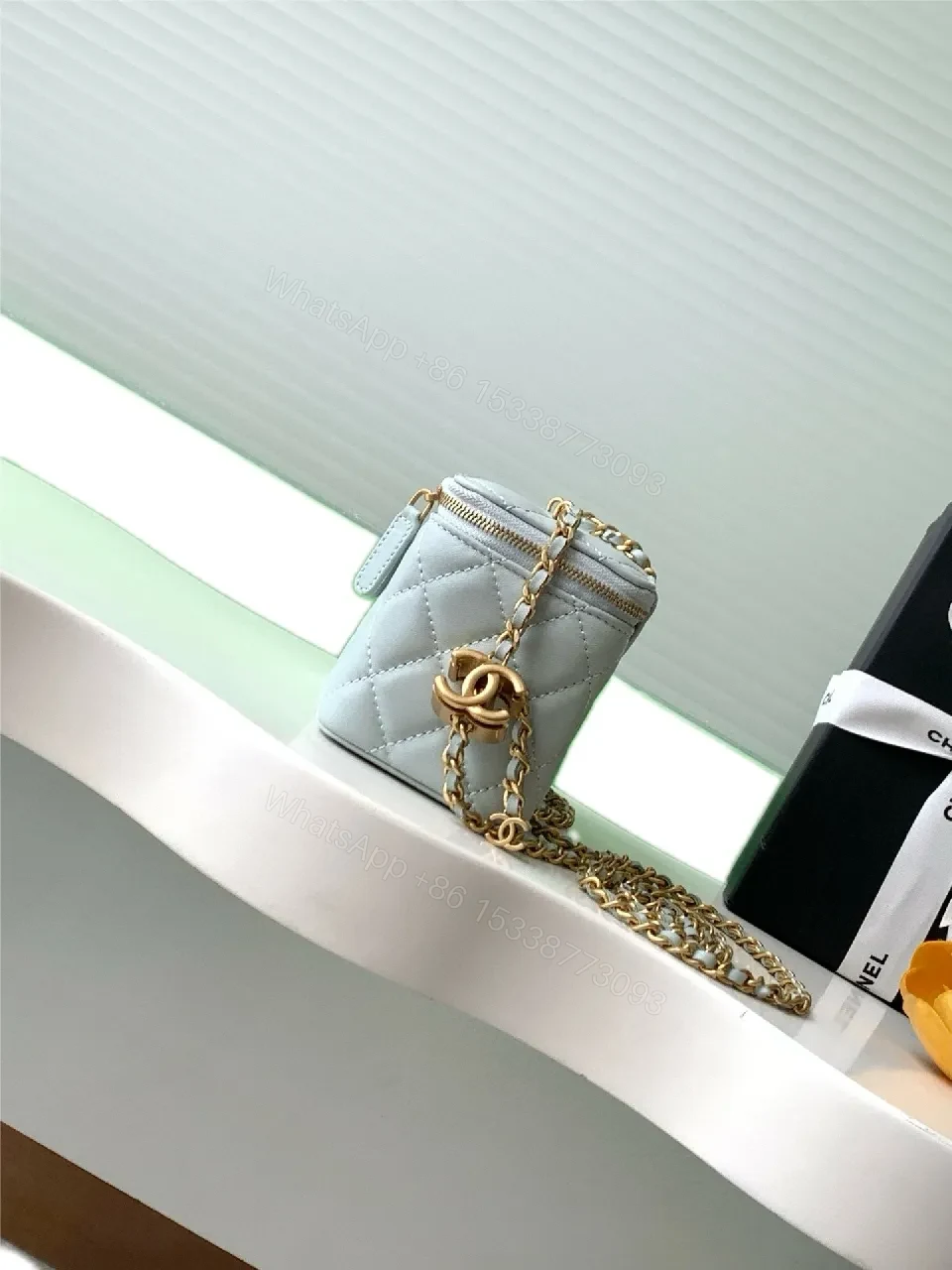 View 5 of Light Blue Quilted Mini Bag with Gold Accents and Chain
