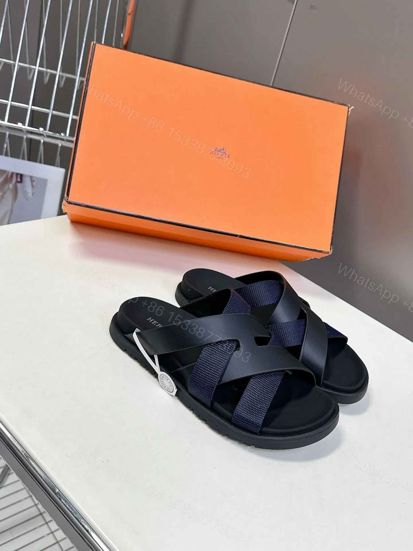 View 3 of Hermes Women Navy Blue Leather And Fabric Sandals