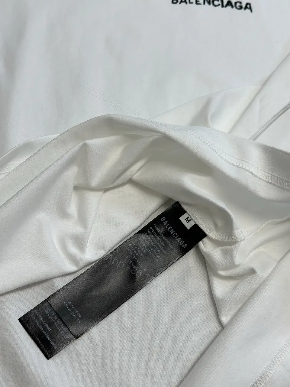 View 5 of Oversized Graphic Tee with Subtle Distress and Logo – Premium Cotton