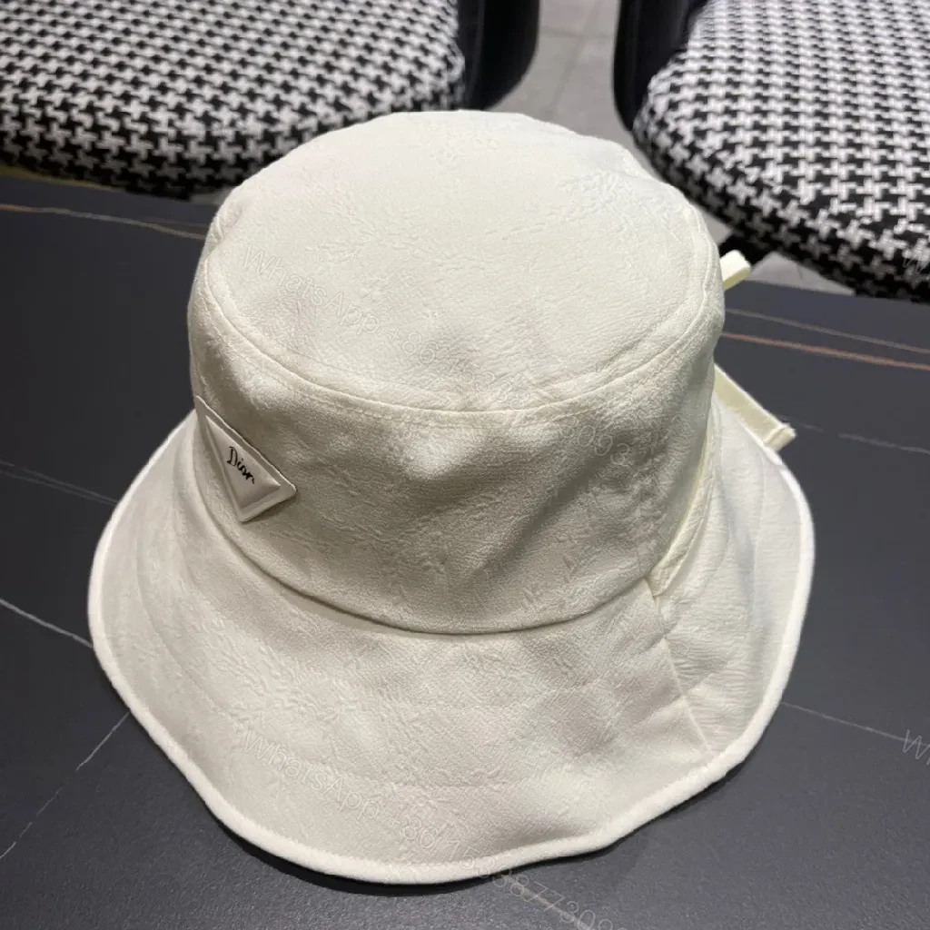View 3 of Compact Luxury Bucket Hat with TriangleEmblem, Off-White, Textured Weave