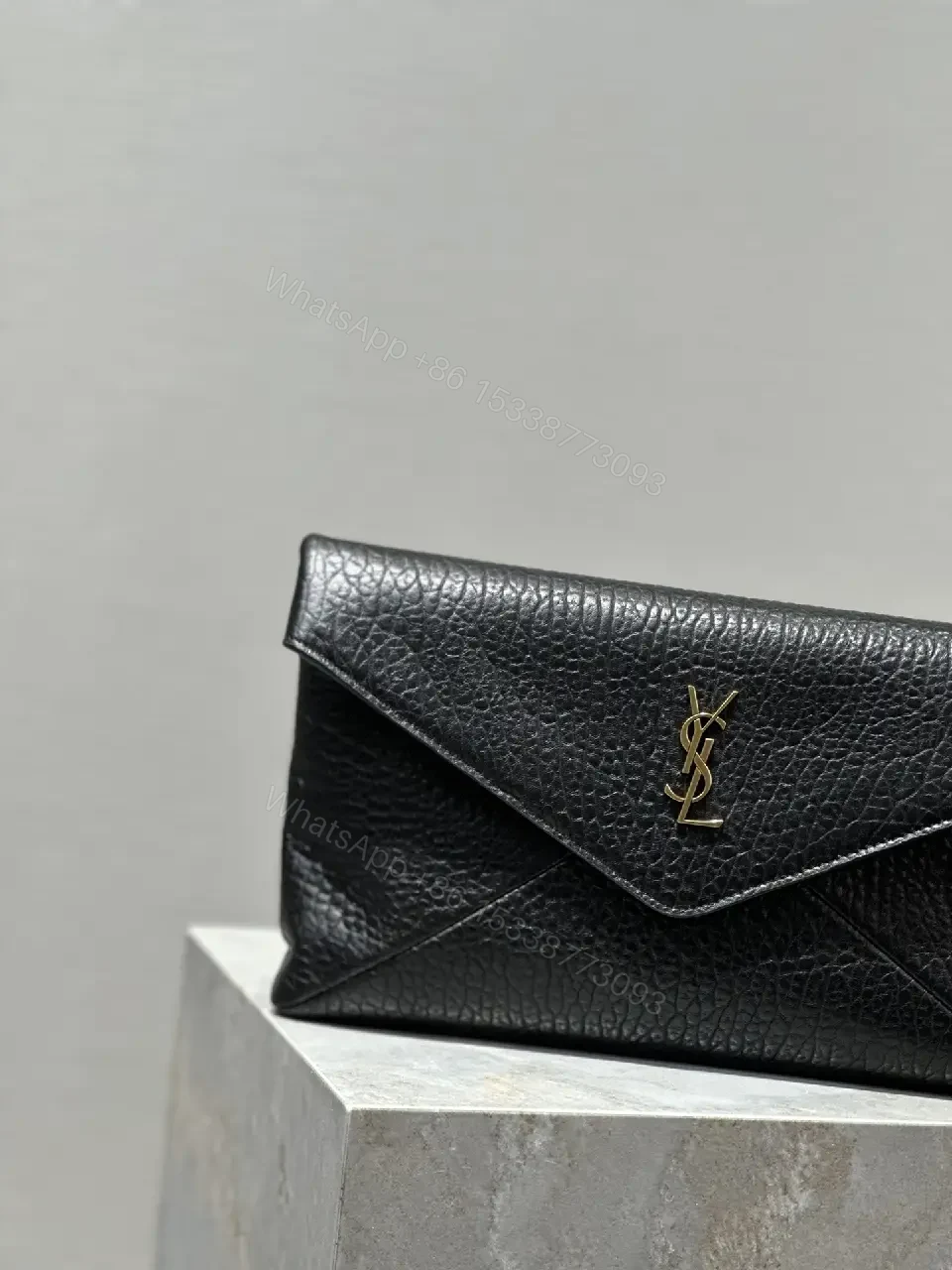 View 5 of Compact Black Leather Envelope Bag with Gold Logo