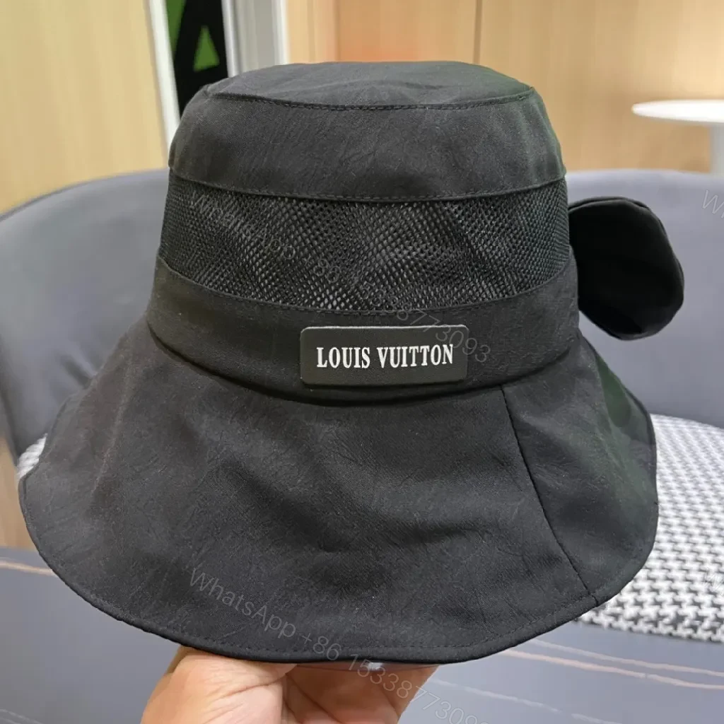 View 9 of Minimalist Black Bucket Hat with Discreet Luxe Label