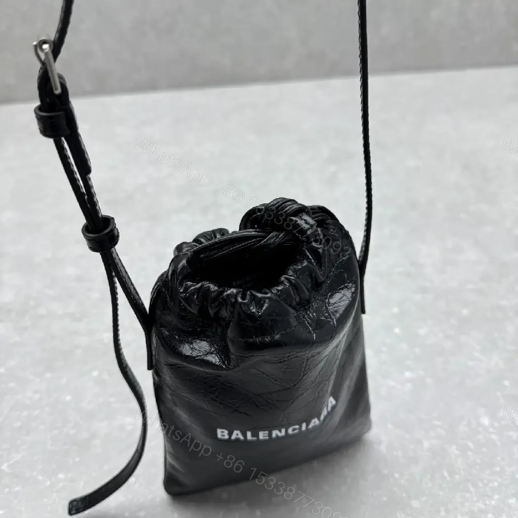 View 8 of Black Leather Drawstring Crossbody Bag - Minimalist Luxe Compact Carry