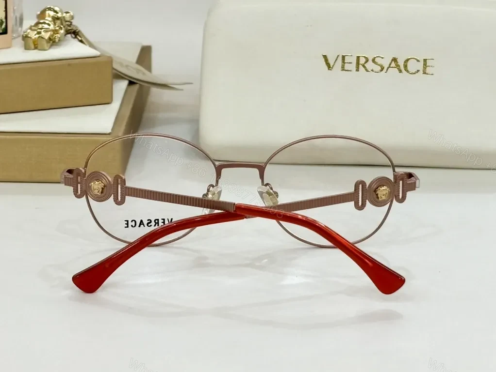 View 5 of Refined Round Eyewear: Luxury Metal Frames with Signature Detail
