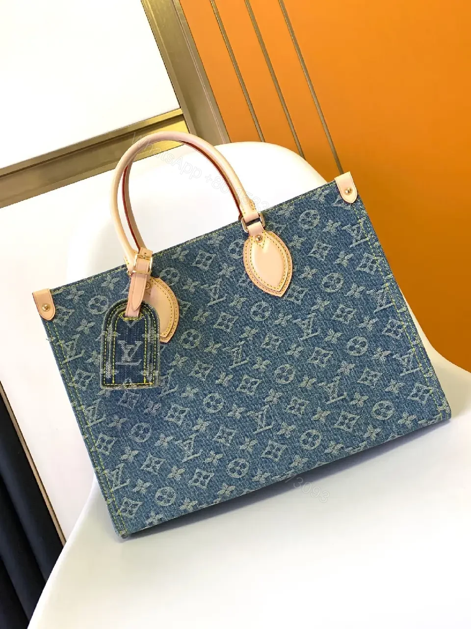 View 10 of Denim Monogram Tote: Premium Denim Leather-Trim Tote with Signature Details